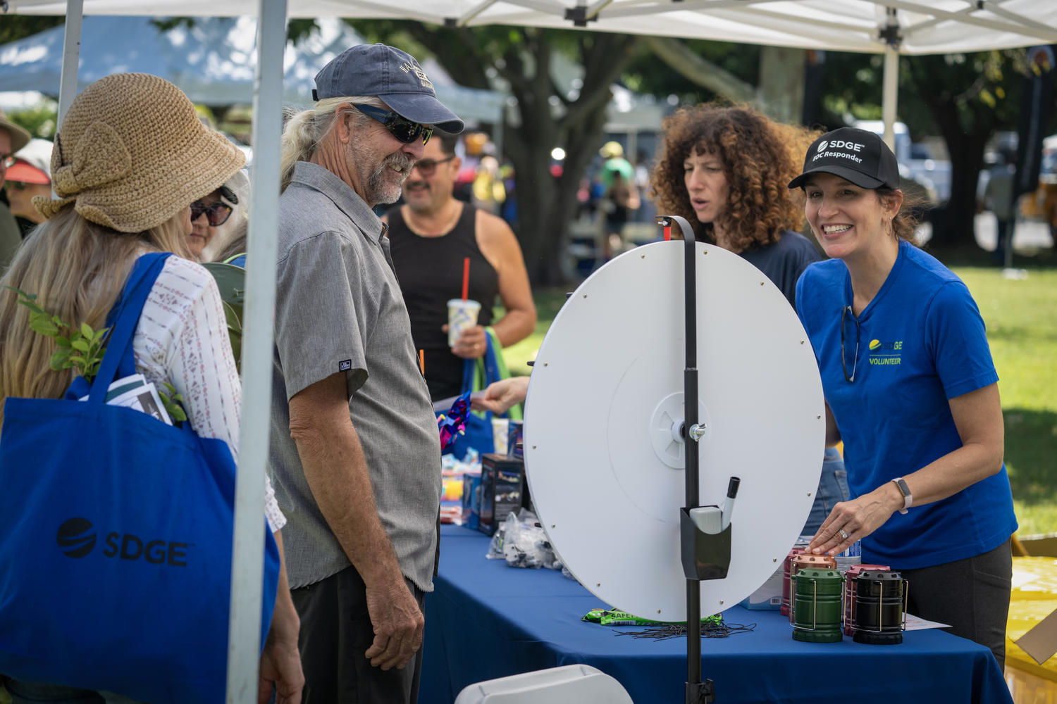 Image of female SDG&E employee smiling with a male participant at the Wildfire Safety Fair.