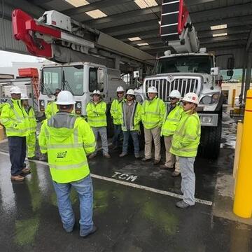 SDG&E field employees gather for a tailgate meeting. 