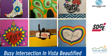 Busy Intersection In Vista Beautified With Children’s Artwork And Trees 