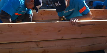 SDG&E employees putting together a raised garden bed