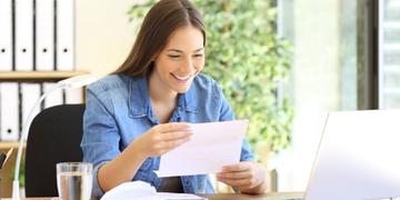 Customer smiling while looking at her bill