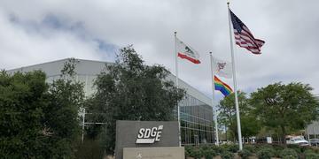 Rainbow flag flying outside Century Park