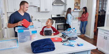 Family putting together an emergency kit