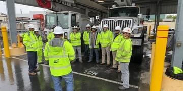 SDG&E crews in rain gear having a safety briefing